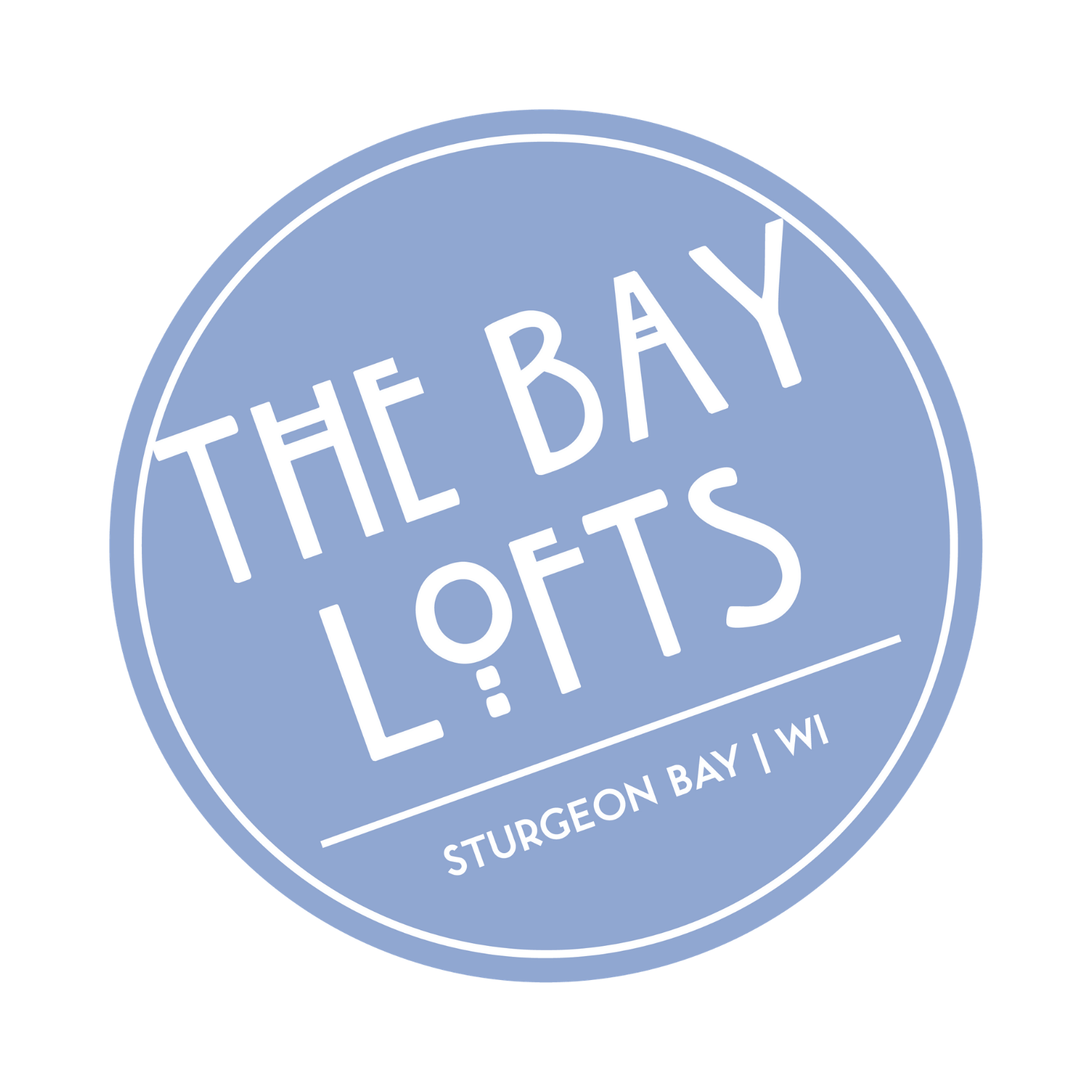 A blue circular logo with the text "The Bay Lofts" and "Sturgeon Bay WI" on it.
